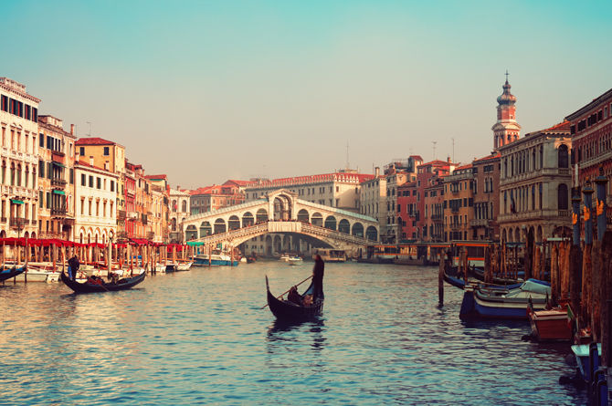 Rialto bridge and gondolas in Venice