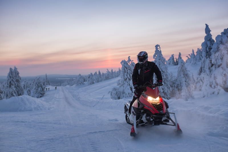 Snowmobiling in Finnish Lapland at wintertime