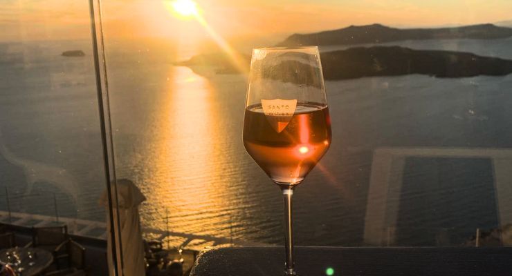 wine glass at sunset Santorini